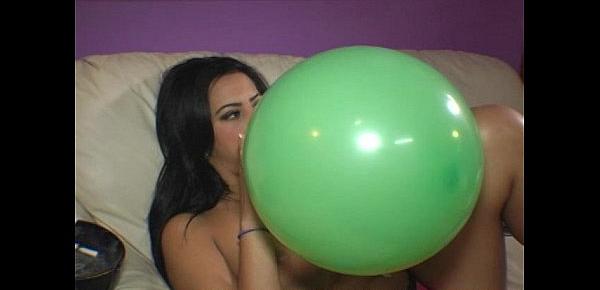  Ava Jay blows to pop balloons